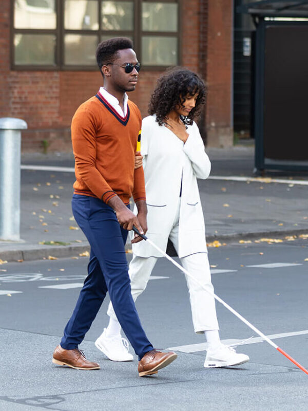 Blind man and his girl friend walking